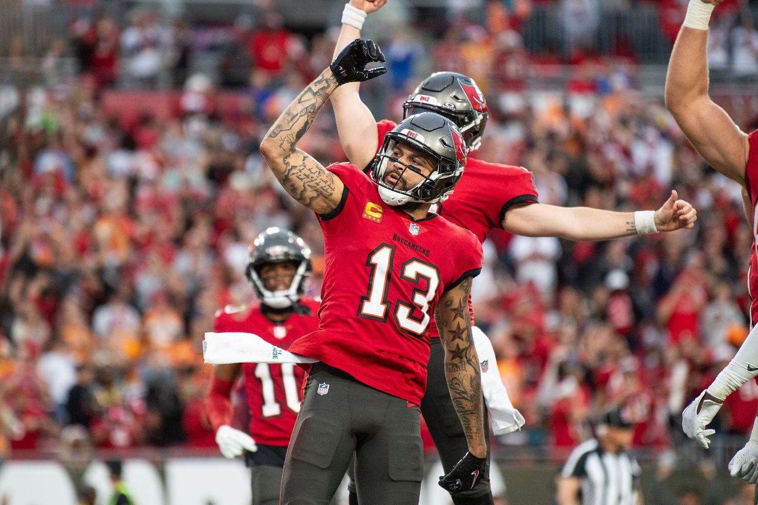 Dec 24, 2023; Tampa, Florida, USA; Tampa Bay Buccaneers wide receiver Mike Evans (13) celebrates the touchdown against the Jacksonville Jaguars in the second quarter at Raymond James Stadium. Mandatory Credit: Jeremy Reper-USA TODAY Sports  